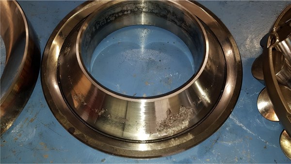 Dissassembled rolling element bearing with damage on the inner race. Dissassembled rolling element bearing with damage on the inner race.